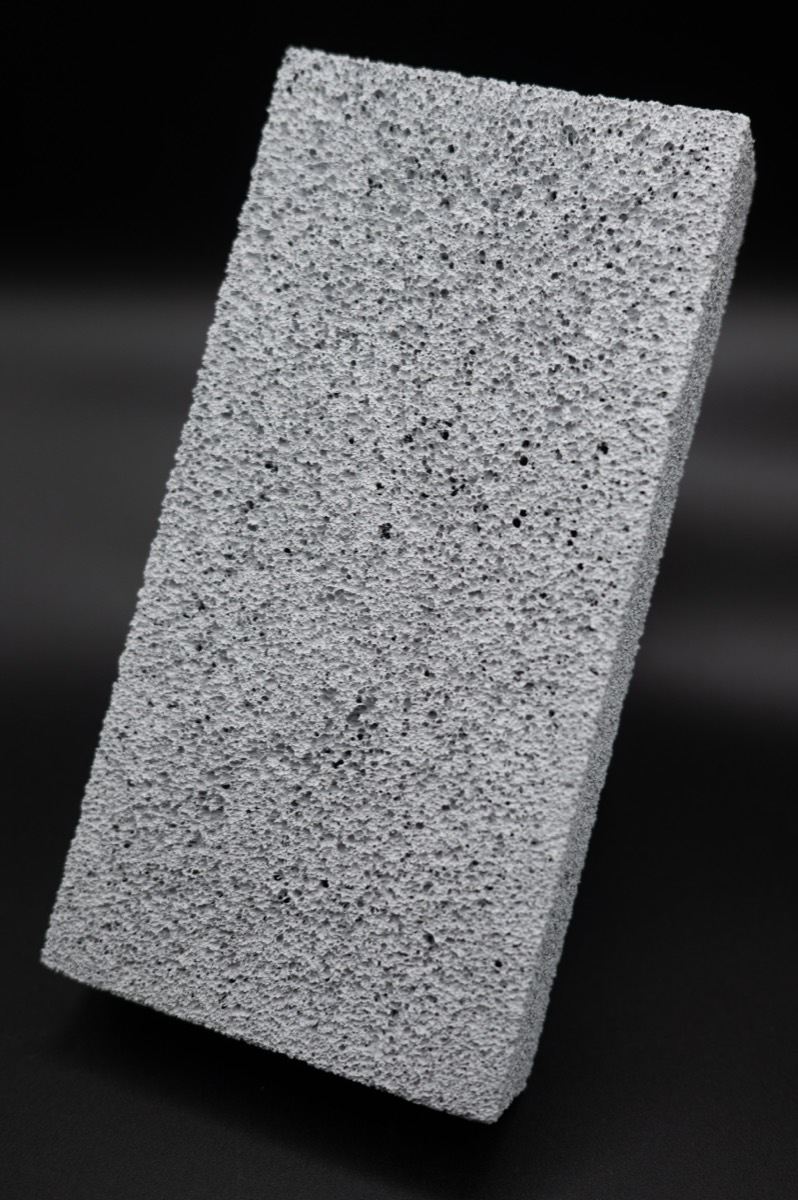A block of FurnaSure white ceramic foam showing its fine porous texture