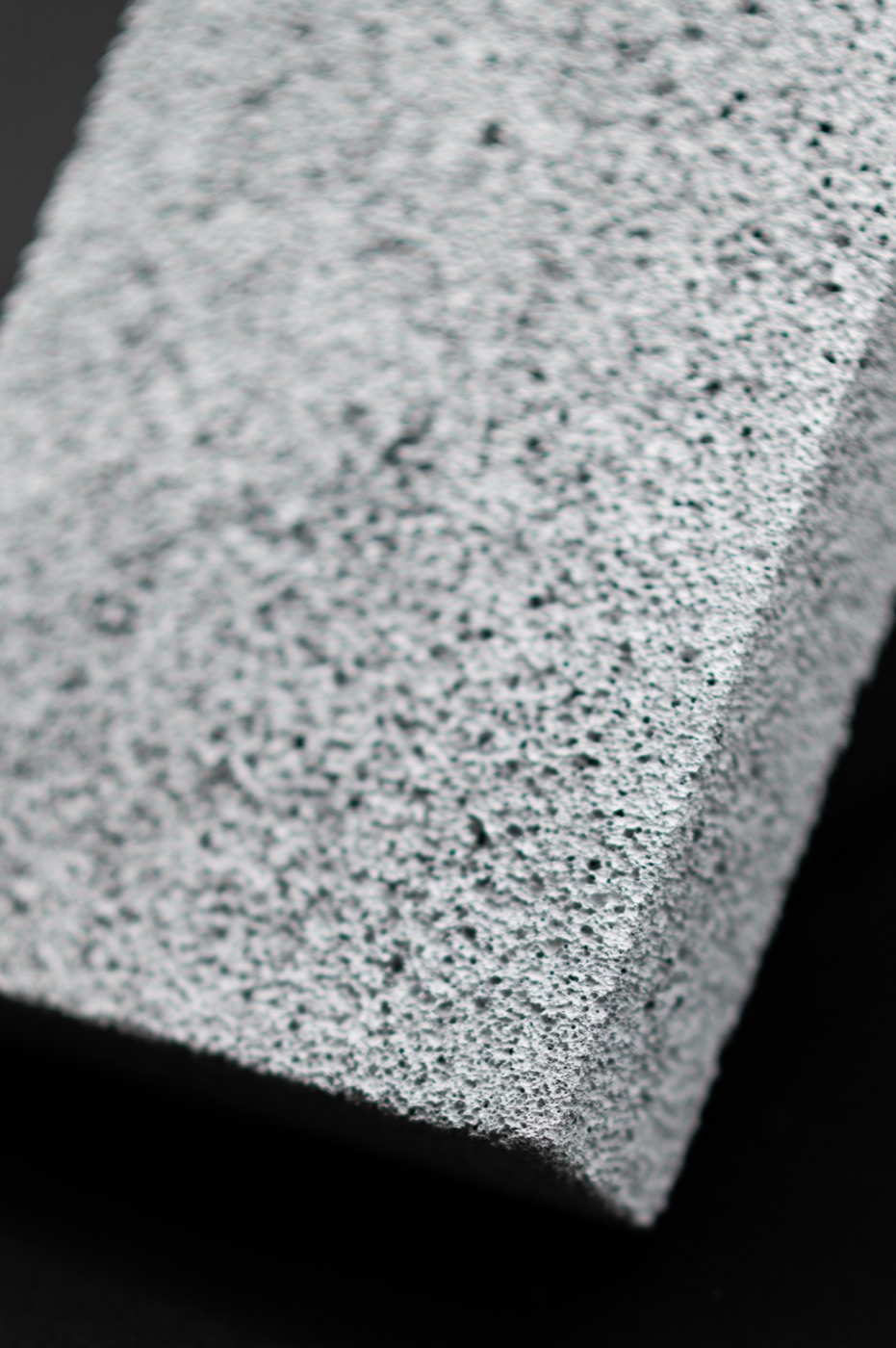 A machined edge of FurnaSure white ceramic foam showing its porous texture