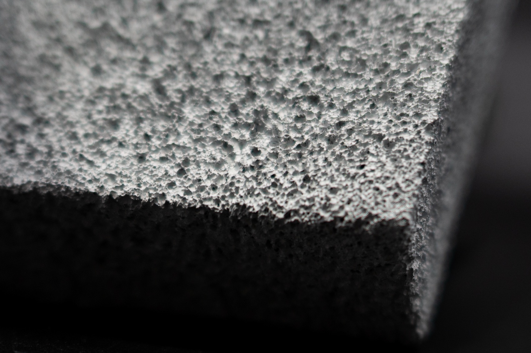 Macro view of FurnaSure white-coated ceramic foam and its machined edge